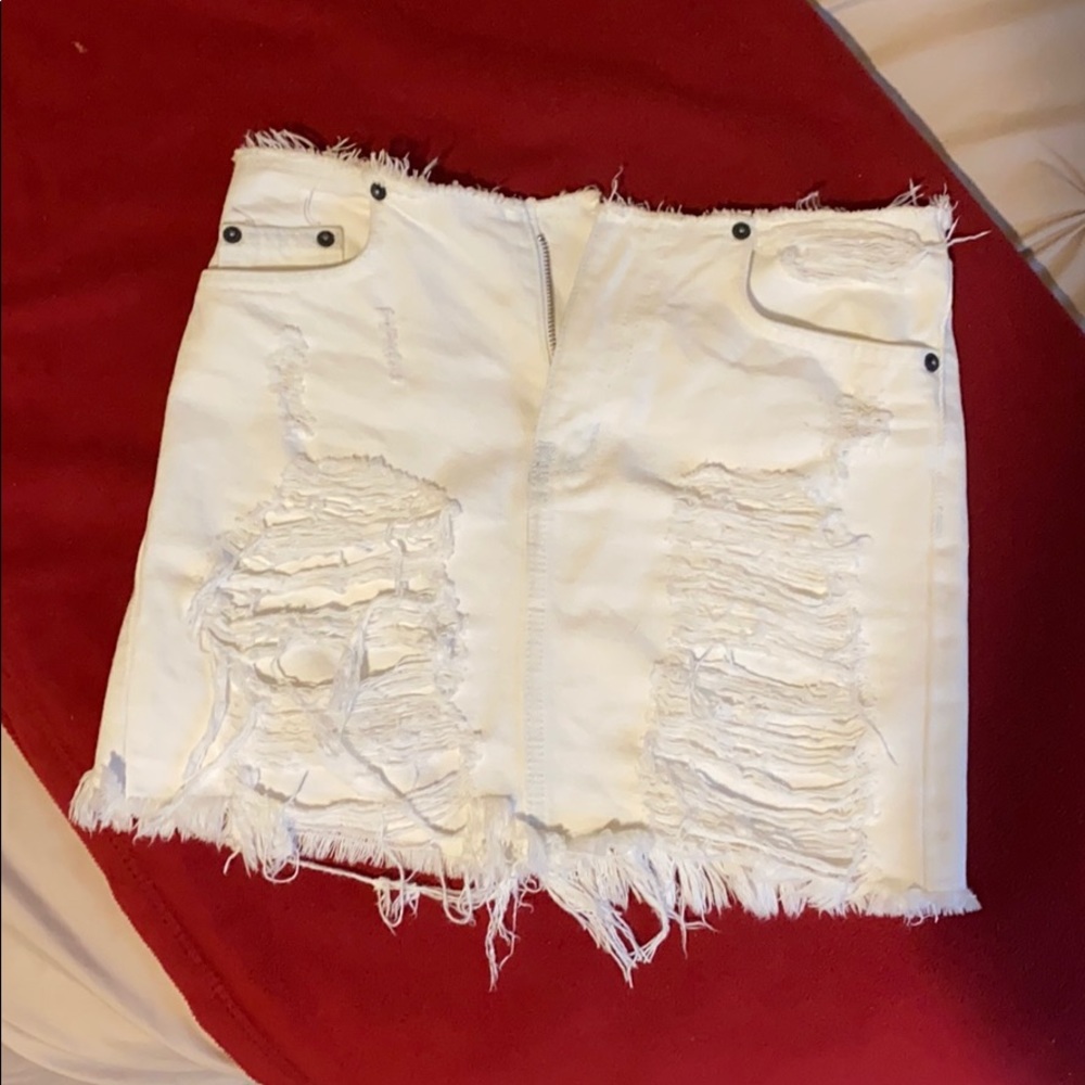Distressed white denim miniskirt